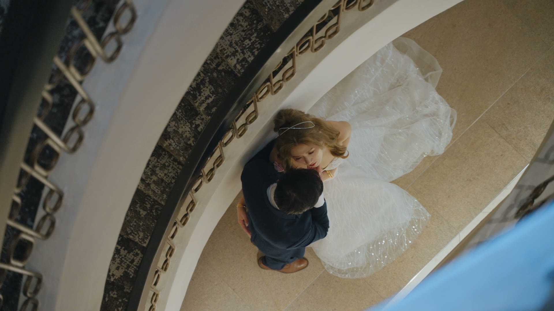 A wedding couple embracing